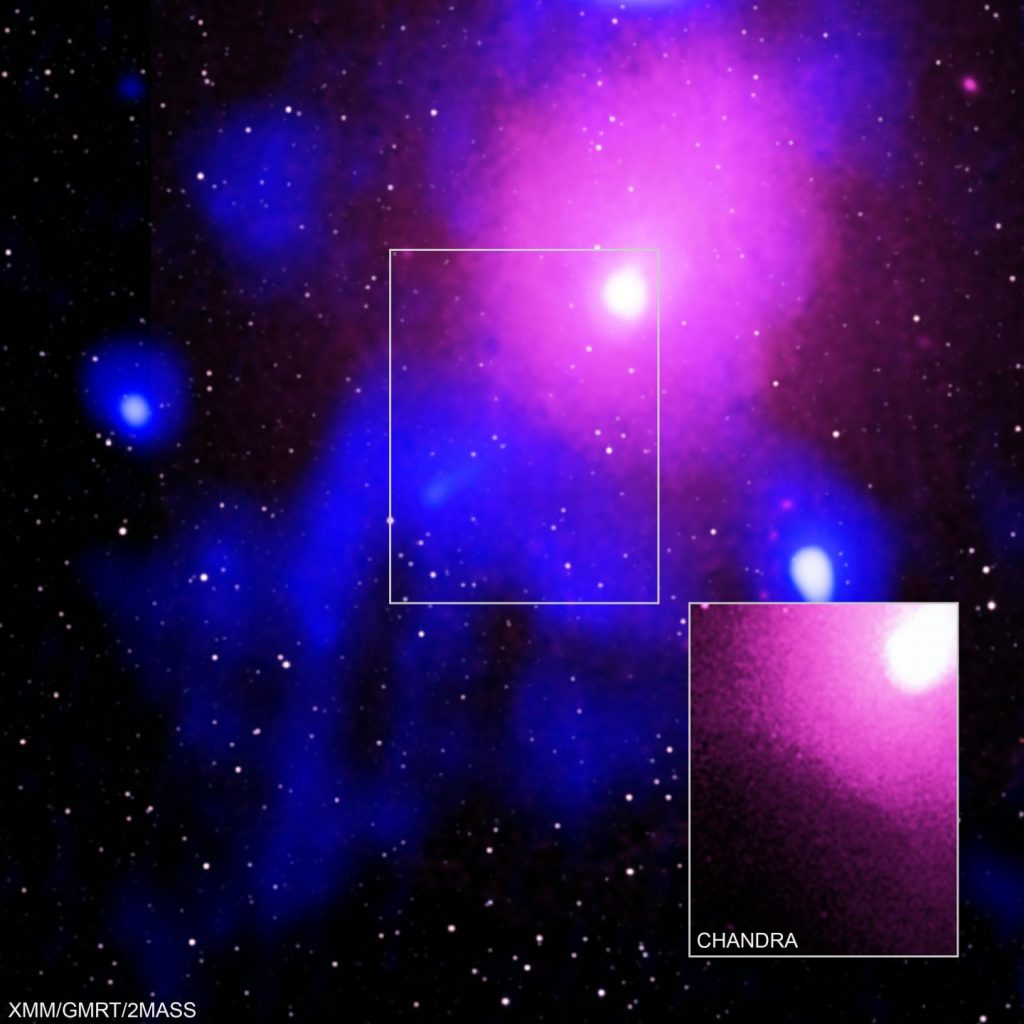 This extremely powerful eruption occurred in the Ophiuchus galaxy cluster, which is located about 390 million light-years from Earth. Galaxy clusters are the largest structures in the Universe held together by gravity, containing thousands of individual galaxies, dark matter, and hot gas. (X-ray: NASA/CXC/Naval Research Lab/Giacintucci, S.; XMM:ESA/XMM; Radio: NCRA/TIFR/GMRTN; Infrared: 2MASS/UMass/IPAC-Caltech/NASA/NSF)