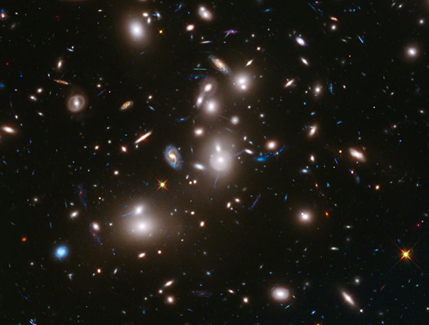 Galaxies seen through the Hubble Telescope. A property of the neutron particle may help clarify why matter and anti-matter didn’t cancel themselves out after the Big Bang. (Photo: NASA/ESA)